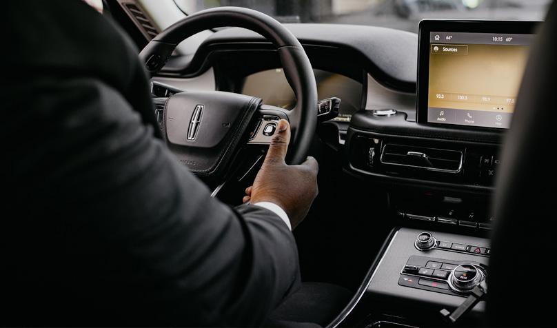 Driver holding steering wheel