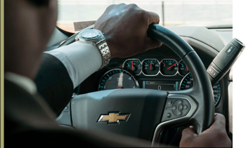 Black SUVs on a highway