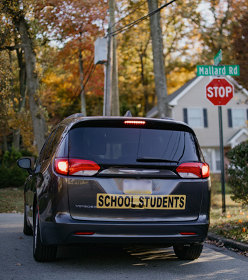 Black SUVs on a highway