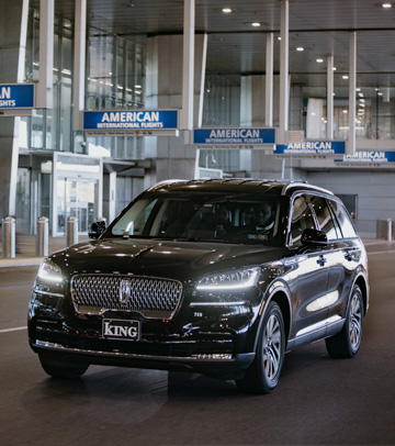 Black SUVs on a highway